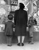 CHRISTMAS SHOPPERS LOOKING AT DISPLAY WINDOW ON MARKET STREET circa 1930S