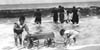 KIDS PLAY ON REHOBOTH BEACH DELAWARE CIRCA EARLY 1900s