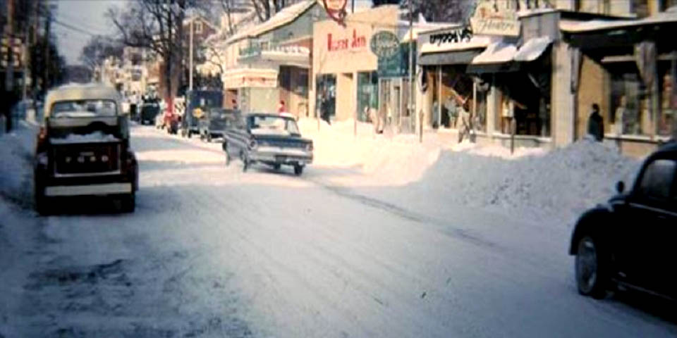 MAIN STREET IN NEWARK DELAWARE IN THE SNOW CIRCA 1960s