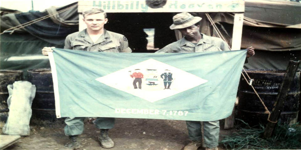 POST DELAWARE PRESENTED THEIR STATE FLAG SHOWN HERE IN VIETNAM LATE 1960s