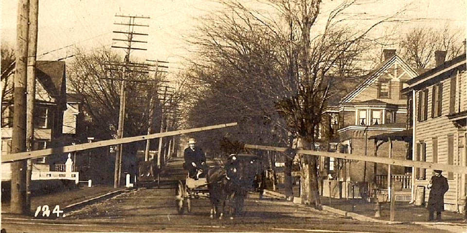 Railroad crossing at West Main Street in Newark Delaware looking west across from the Deer Park Tavern circa 1910 - 1