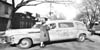 Red Cross Motor Corps Ann Naulty is shown standing by new ambulance in Wilmington Delaware 01-17-1942