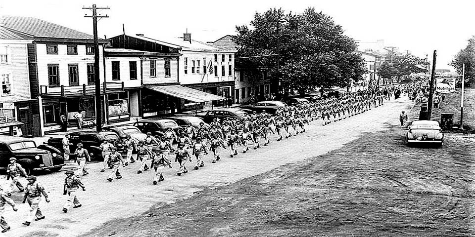 Soldiers from Fort DuPont march down Clinton Street Delaware City in the Memorial Day Parade 1943